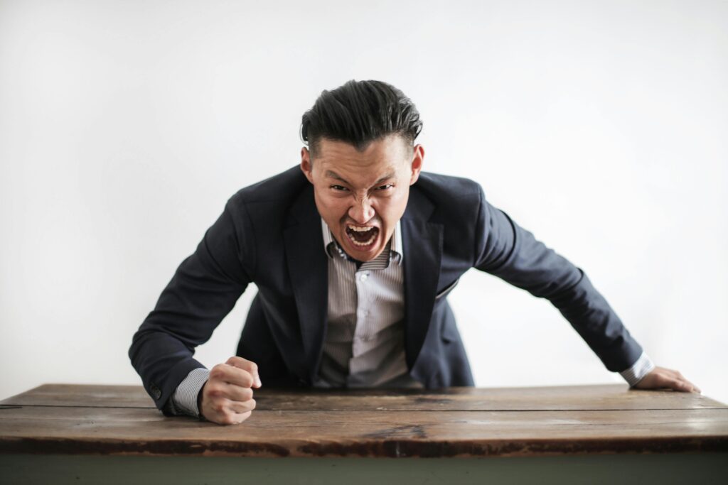 Angry man thumps table