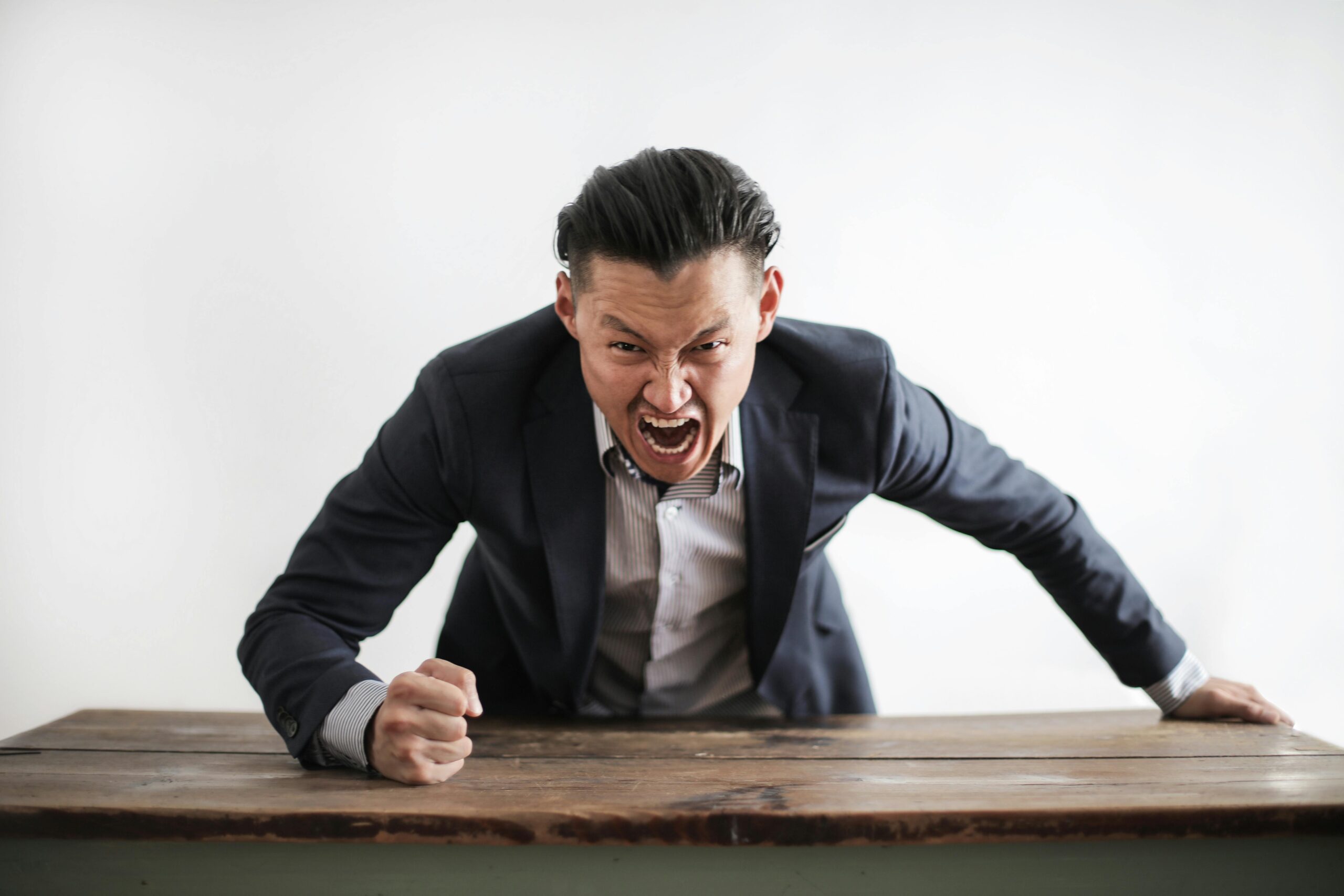 Angry man thumps table