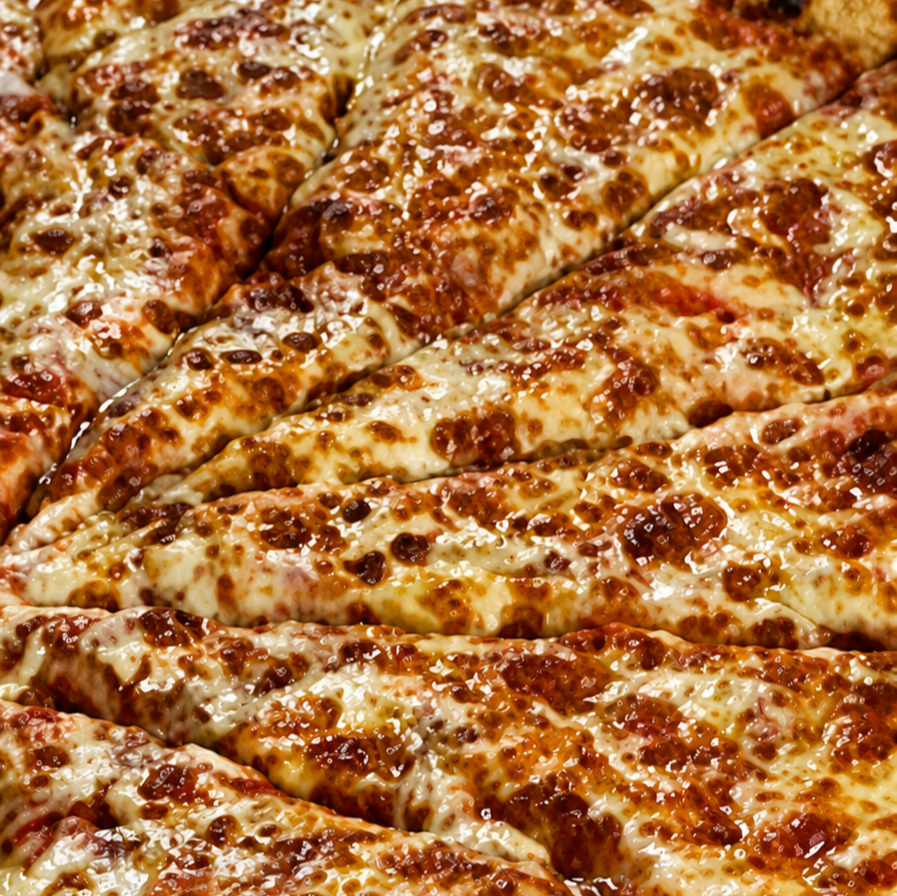 A close up image of margherita pizza slices.