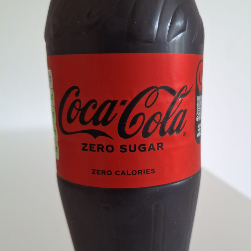 An image of a Coca-Cola Zero bottle, zoomed in on the label.
